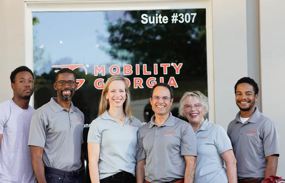 The Mobility Georgia team in front of the Suite 307 showroom
